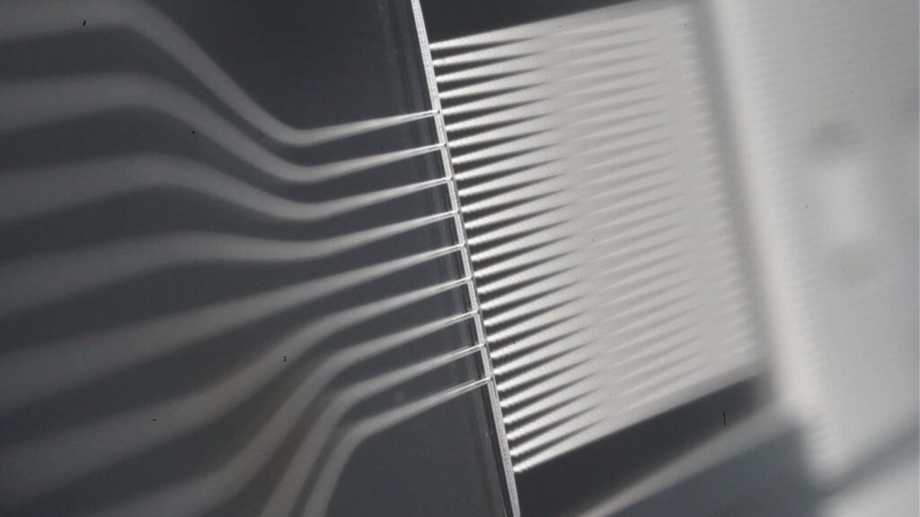 Through Glass Via for Photonic and Optical Interposers